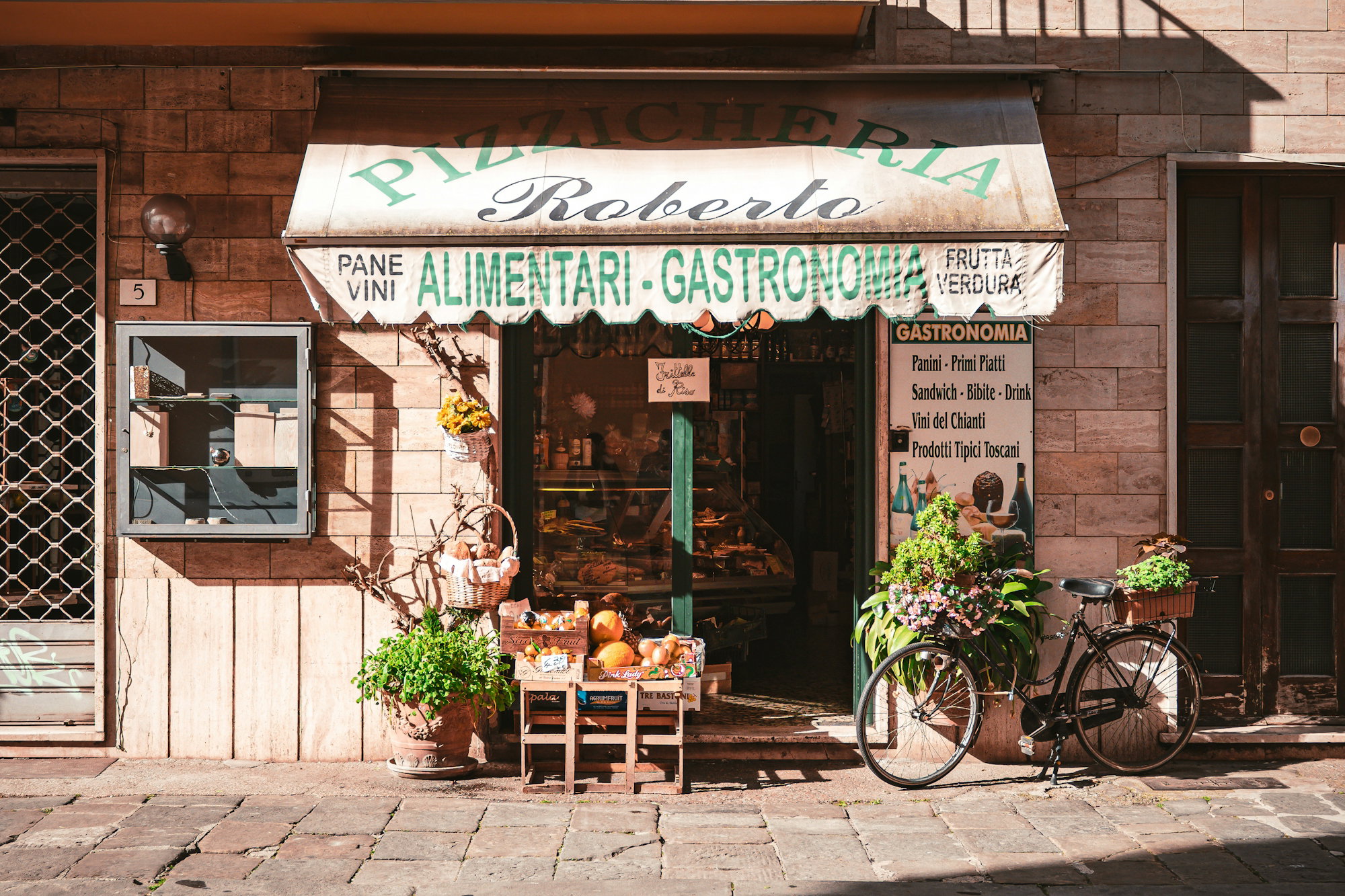 a-bicycle-is-parked-outside-of-a-store.jpg a bicycle is parked outside of a store